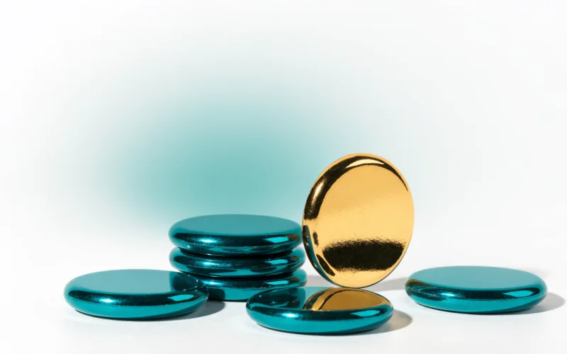 Teal and gold tokens representing collected loyalty points